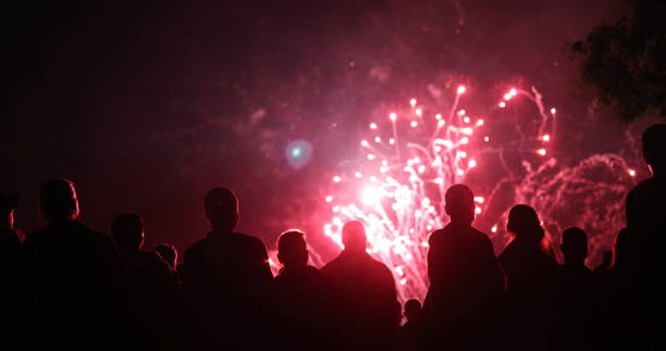 istock Crowd watching fireworks and celebrating new year eve 1069503282