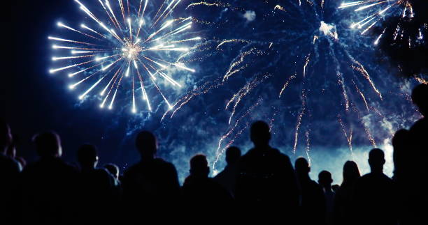 istock Crowd watching fireworks and celebrating new year eve 1069503288