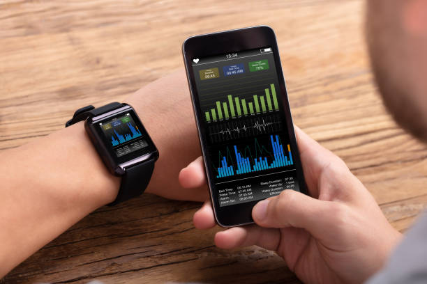 istock Man With Mobile And Smartwatch Showing Heartbeat Rate 1069503872