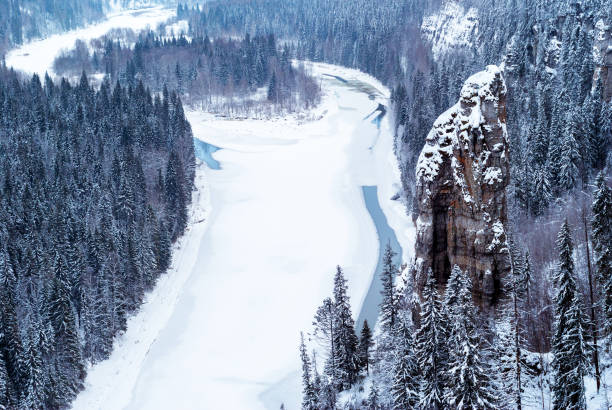 istock frozen river in a snowy wooded canyon 1069504242