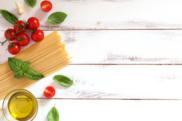 istock Ingredient for cooking Italian pasta - spaghetti, tomato, basil and garlic. 1069506274