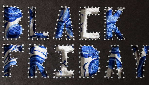 istock Words BLACK FRIDAY are cut out from carton paper. 1069506374