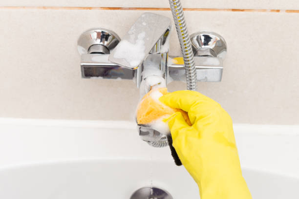 istock Person disinfecting inox tap 1069506568