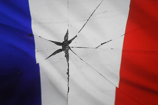 France flag is reflected in broken mirror