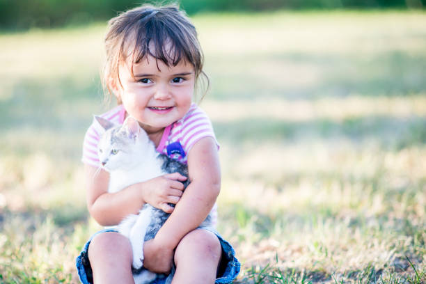 istock Toddler with new cat 1069512280