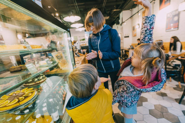 istock Children choosing desserts in cafe 1069514534