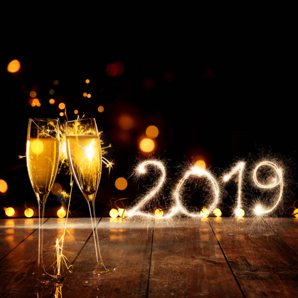 istock Champagne Glasses With Sparkler Happy New Year 2019 1069514548