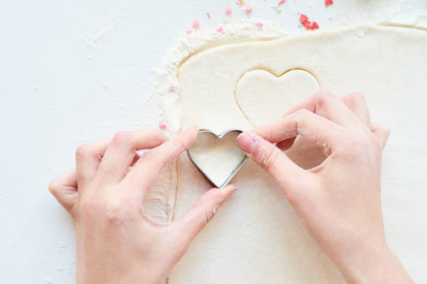 istock Woman making cookies 1069514636