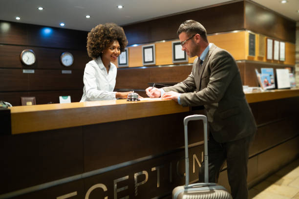 istock Businessman register in hotel 1069516882
