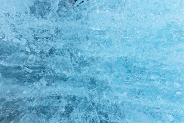 Blue ice texture, winter background, texture of ice surface, close-up.