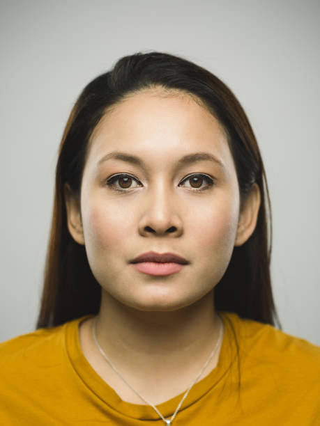 real malaysian young woman with blank expression - serious women asian ethnicity human face imagens e fotografias de stock