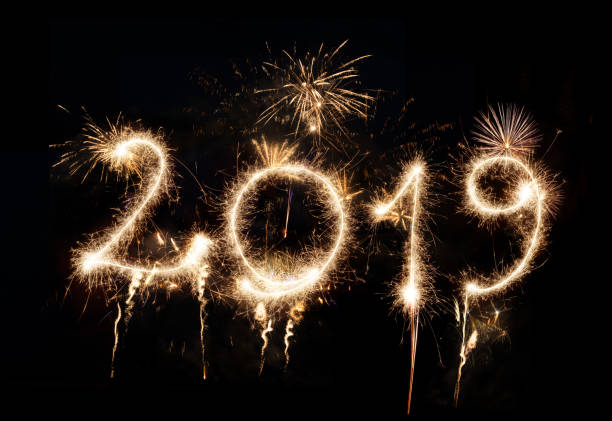 istock Sparkler Happy New Year 2019 With Fireworks 1069519860
