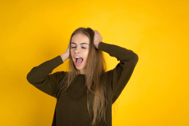 istock Happy screaming pretty woman in sweater 1069520702