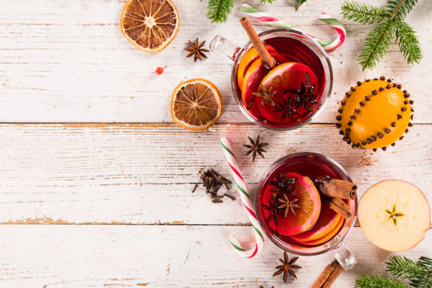 istock Christmas hot mulled wine with spices on wooden background. 1069528070