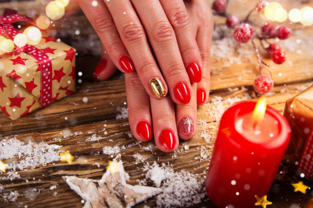 Woman with beautiful red nails on vintage wooden table Woman with beautiful red nails on vintage wooden table, top-down view. christmas nails stock pictures, royalty-free photos & images