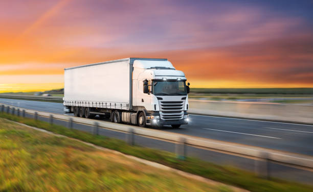 istock Truck with container on road, cargo transportation concept. 1069528296