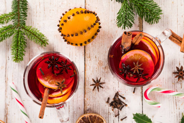 istock Christmas hot mulled wine with spices on wooden background. 1069528562