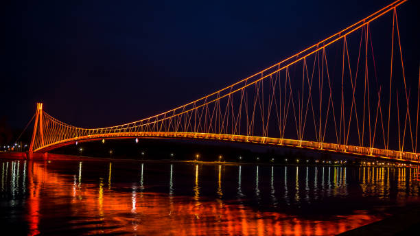 Side view of a colorful modern pedestrian bridge. Night in Osijek, Croatia. Osijek, Croatia. Nov 2, 2018. Side view of a colorful modern pedestrian bridge. osijek photos stock pictures, royalty-free photos & images