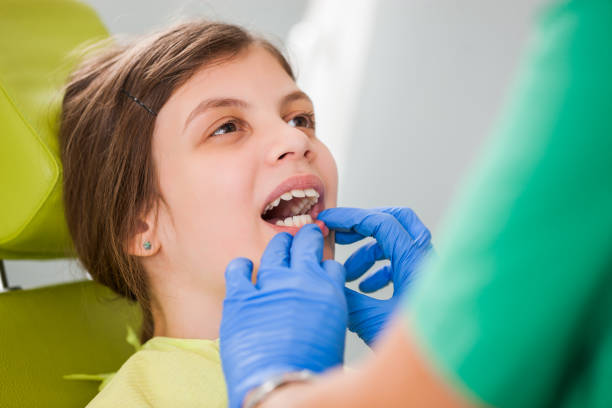istock Little girl at dentist 1069531152