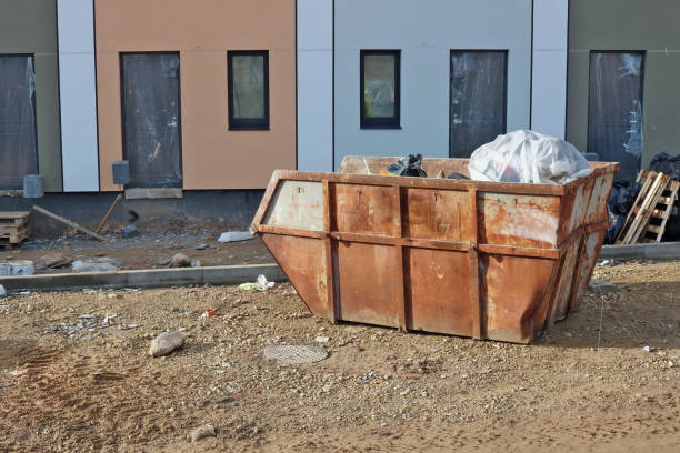 istock The old rusty  steel container  on construction site  filled with wast and  debris costs. 1069532892