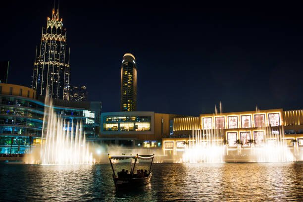 Dubai, United Arab Emirates - February 5, 2018: Dubai fountain show at night with high rising water and music which attracts many tourist daily