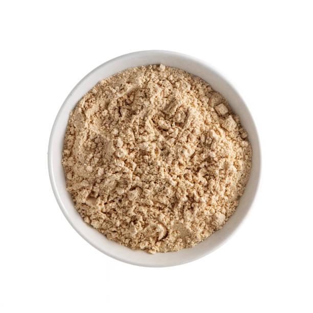 istock Protein powder in white bowl isolated on white background. Top view 1069534236