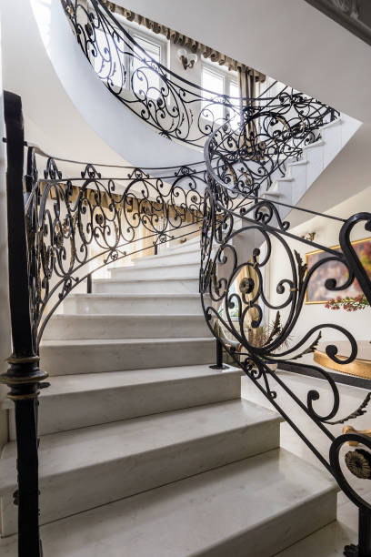 istock Staircase with handmade wrought Iron Railing. luxury lobby interior 1069535600