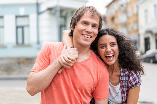 istock Couple embracing and walking on street 1069535694