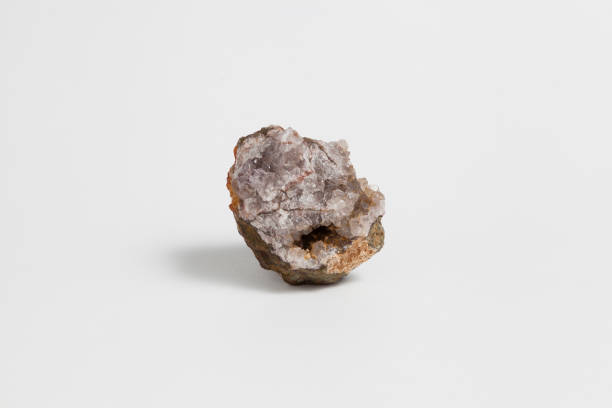 istock Quartz geode fragment raw ore isolated on white background. 1069536744