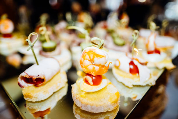 istock shrimp canapes with cherry tomatoes, canape, bread with rolled bacon 1069537838