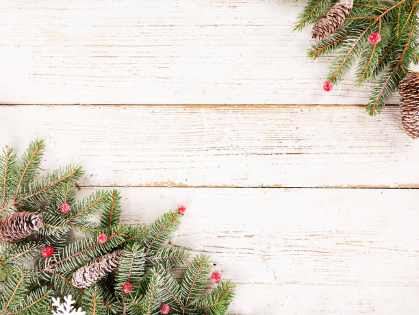 istock Christmas spruce branches decoration on wooden background 1069538142