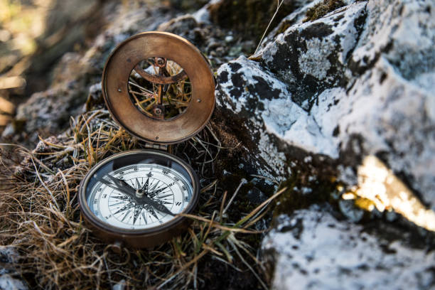 istock Retro analogic compass on the mountains rocks. 1069538756