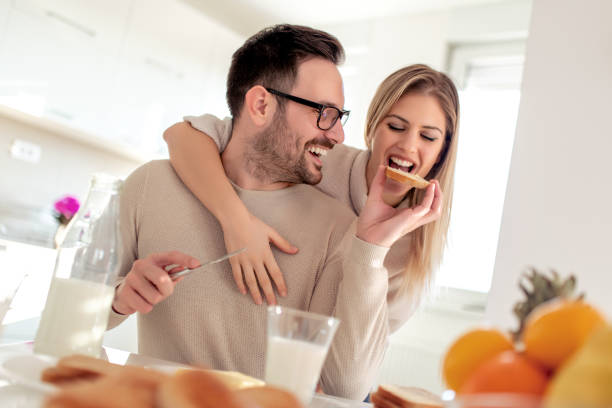 istock Young happy couple having breakfast together 1069542318