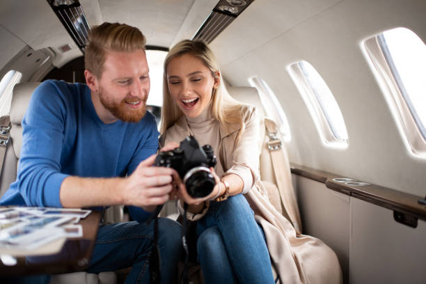 istock Rich young tourist couple inside a private airplane 1069542330