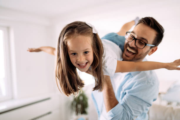 istock Happy family having fun time at home 1069542364