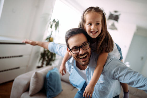 istock Happy family having fun time at home 1069542368