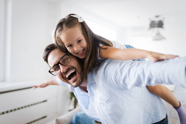 istock Happy family having fun time at home 1069542376