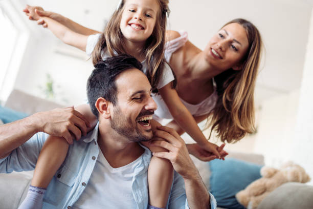 istock Happy family having fun time at home 1069542440
