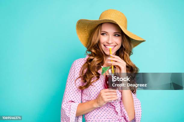 Attractive Pretty Lovely Cute Sweet Gorgeous Lady With Panama On Head Her Style Stylish Curly Wave Trendy Hairdo She Look Aside Hold Beverage In Hands Isolated On Bright Turquoise Background Stock Photo - Download Image Now