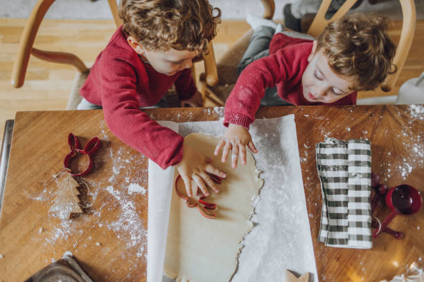 istock Boys cooking christmas cookies 1069546478