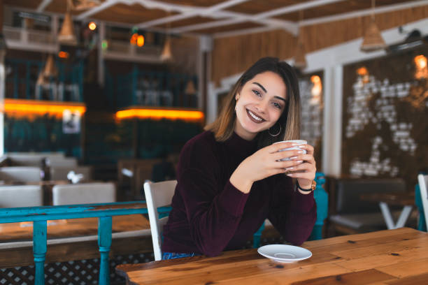 istock happy women drinking tea - coffee 1069546678