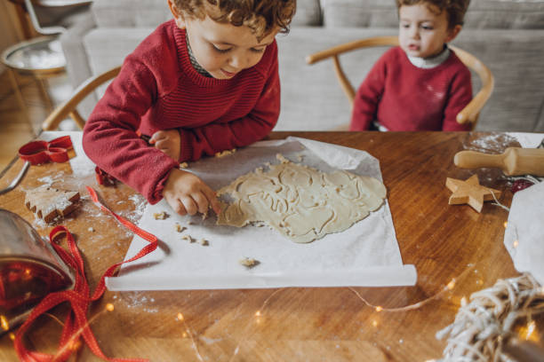 istock Boys cooking christmas cookies 1069546732