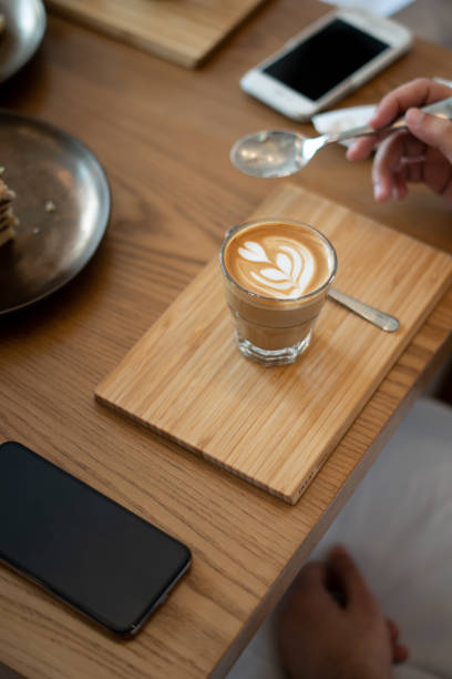 istock Coffee on Wooden Table in Cafe 1069547510