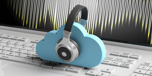 istock Cloud computing and music. Blue clouds and headphones on computer background. 3d illustration 1069547888