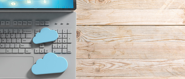 Cloud computing concept, Computer and blue clouds on wooden background, banner, copy space. 3d illustration