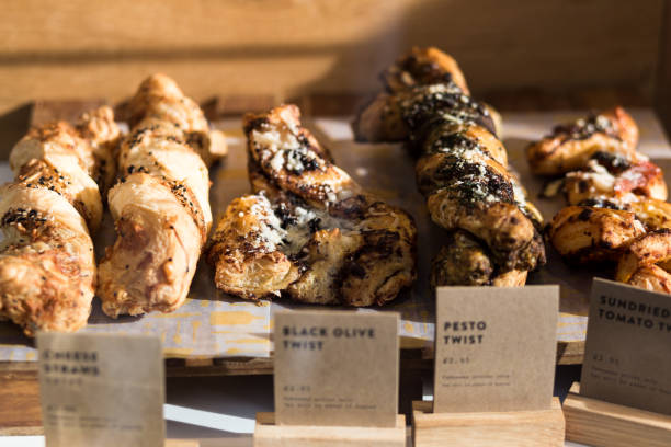 Freshly baked cakes and pastries in a row at food market
