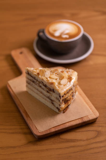 istock Cake on Wooden Table in Cafe 1069549436