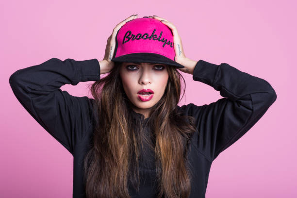 istock Surprised rebel young woman against pink background 1069551030