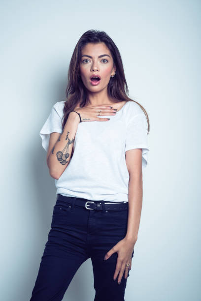 istock Shocked young woman gasping and rolling eyes 1069551184