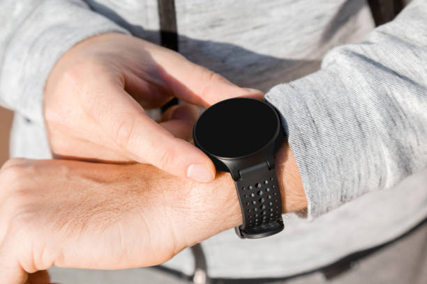 istock Young man using black smart watch. Checking heart rate before and after workout. Monitoring of daily health with modern device. Closeup. Place for text, logo or mobile app on empty screen. Copy space. 1069553618